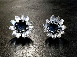 Oxidised flower earrings on a black background | piercing saw | jewellery making Classes