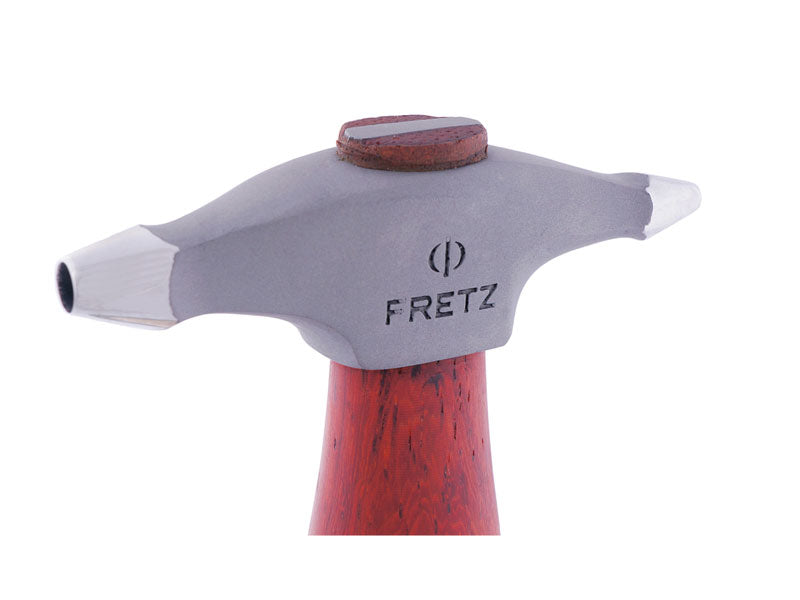 Close-up of the Fretz HMR-15 texturing hammer head showing its two concave circle faces