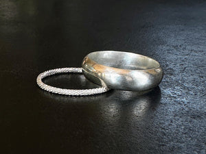 Two silver rings on a dark surface | Jewellery Making Supplies