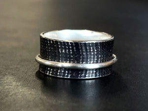 Oxidised Silver Spinner Ring band on a dark surface | Jewellery Making Classes