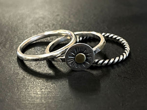 Three silver rings on a dark surface | Jewellery Supplies Adelaide
