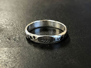 Oxidised Silver ring stamped with a tree design on a dark surface | Jewellery making classes