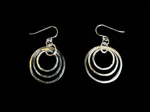 Silver hoop earrings on a black background | jewellery tools Australia