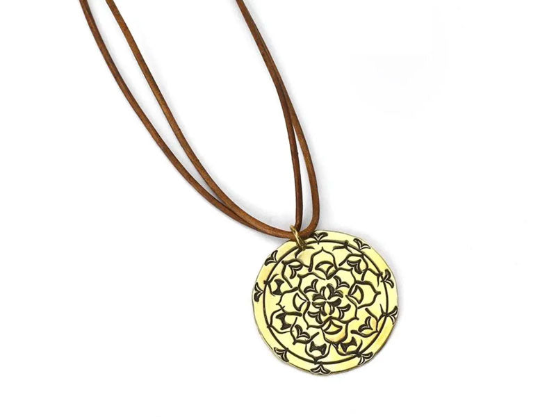 Brass pendant stamped with mandala metal stamps