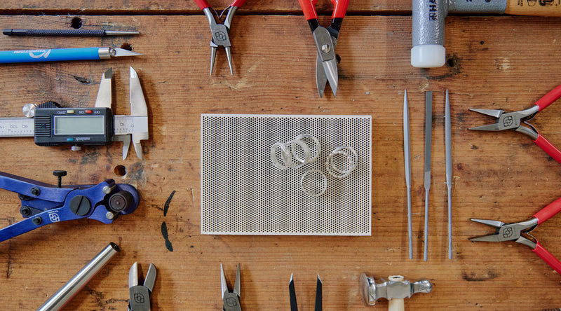 Collection of jewelry-making tools on a wooden surface | Australian Jewellery Supplies