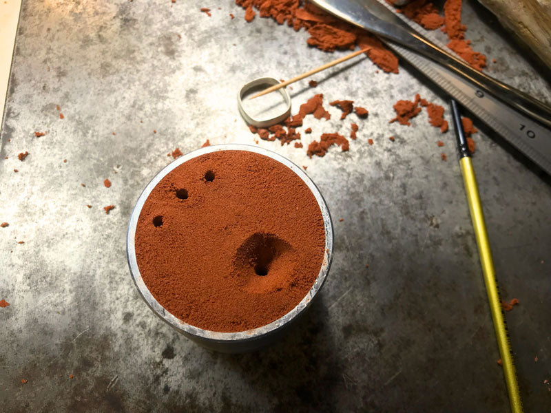The delft clay mould ready to pour in the moulten metal