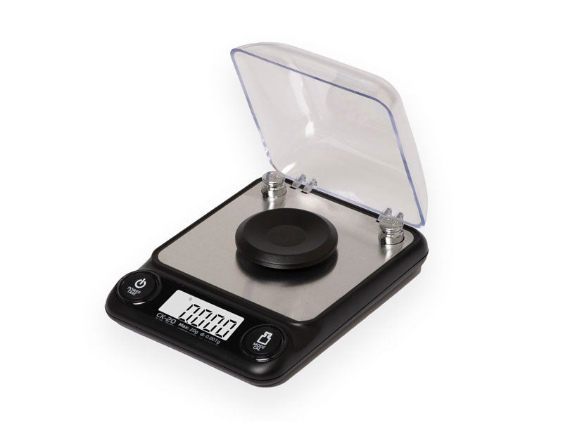 A digital carat scale with a clear cover, black base, and a display screen showing weight in grams | digital scales