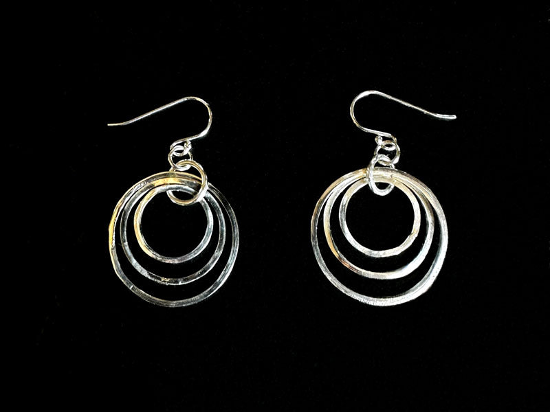 Silver hoop earrings on a black background | jewellery tools Australia
